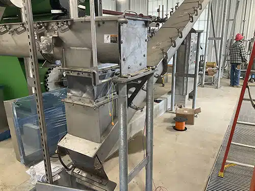 Flexible Chute Creates Easy Transfer to Inclined Screw Conveyor